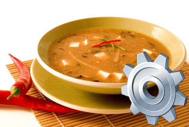 Teller Suppe mit einem Zahnrad-Symbol im Vordergrund