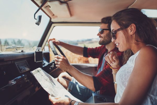 man at the wheel and woman with map