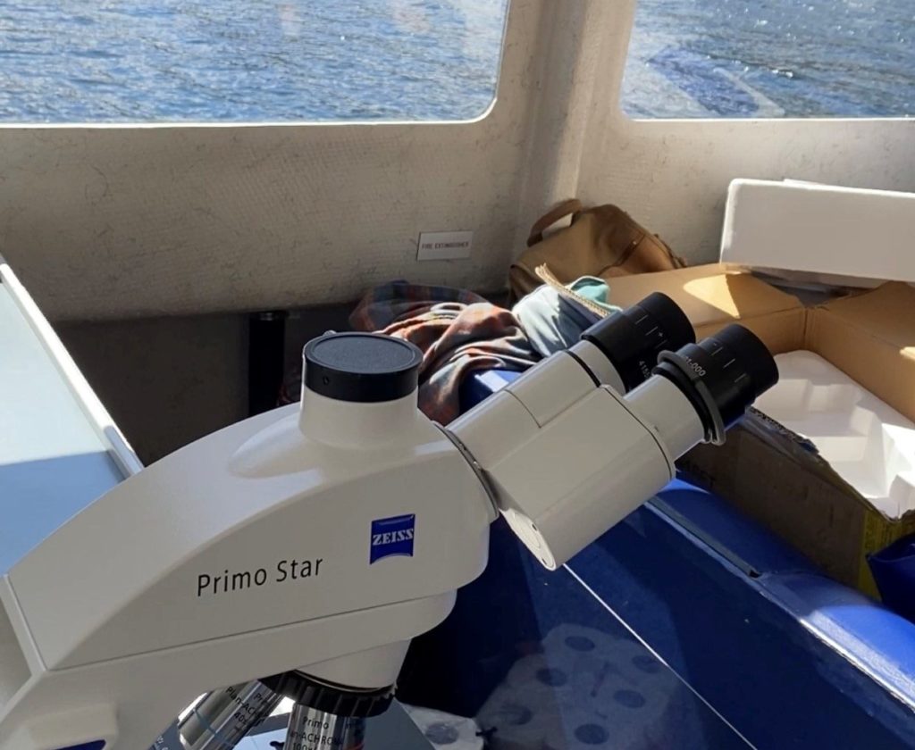 Dr. Michelle Oakley shows her ZEISS Primostar on a boat traveling through the remote Canadian and Alaskan wilderness.